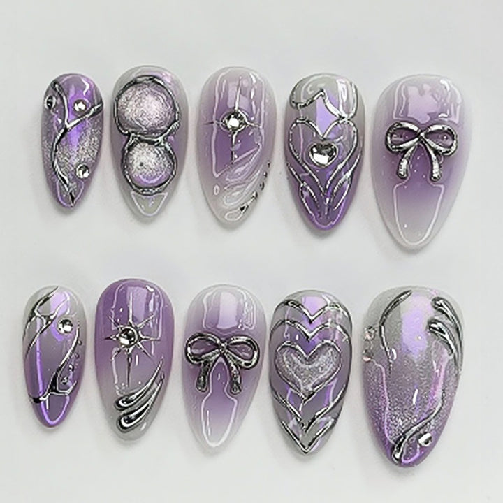 Kunstnagelset mit elegantem Ombre-Design und filigranen Verzierungen Karnz