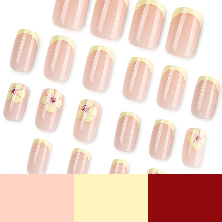 Kunstvolle French-Tip Nägel mit Blumenverzierungen Karnz