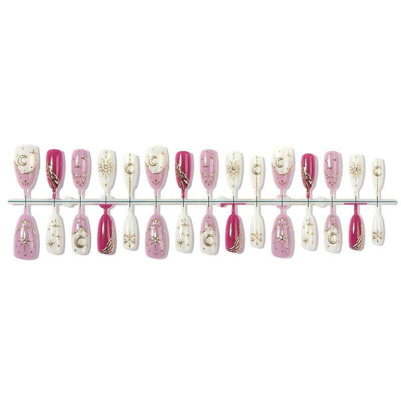 Kunstnagelset mit glamourösen Glitter- und Sternakzenten Karnz