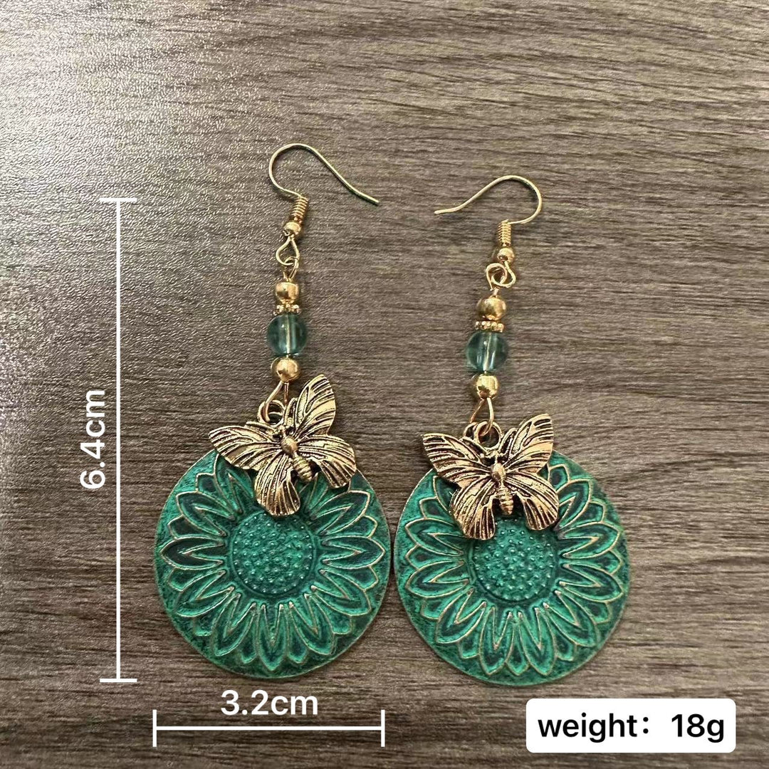 Elegante Ohrhänger mit Blumenmotiv und Schmetterlingen Karnz
