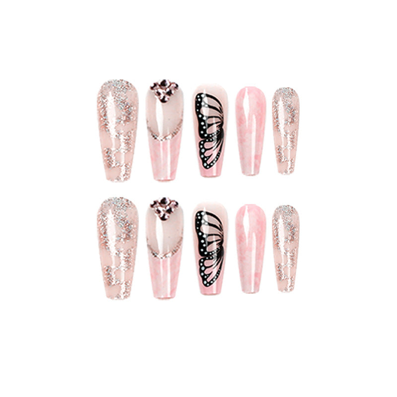 Glamouröse Nagelverlängerungen mit wunderschönen Schmetterlingsmotiven und Glitzerakzenten Karnz