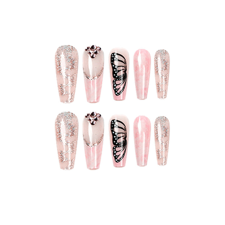 Glamouröse Nagelverlängerungen mit wunderschönen Schmetterlingsmotiven und Glitzerakzenten Karnz