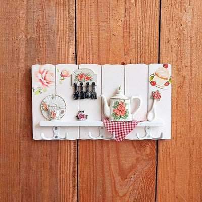 Dekorativer floral Wandhakenregal