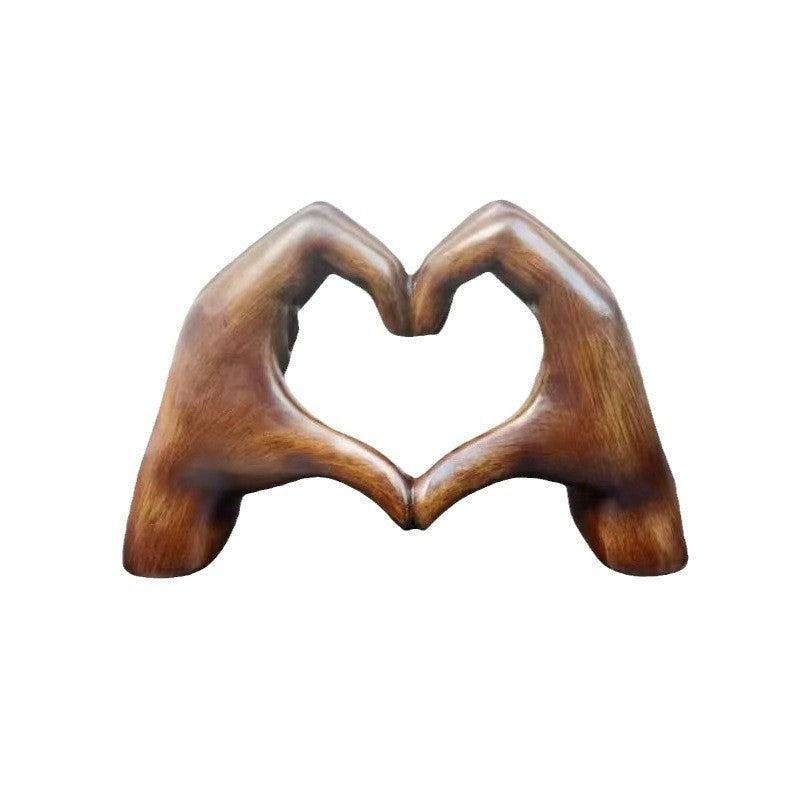 Herzförmige Holz-Handskulptur Karnz