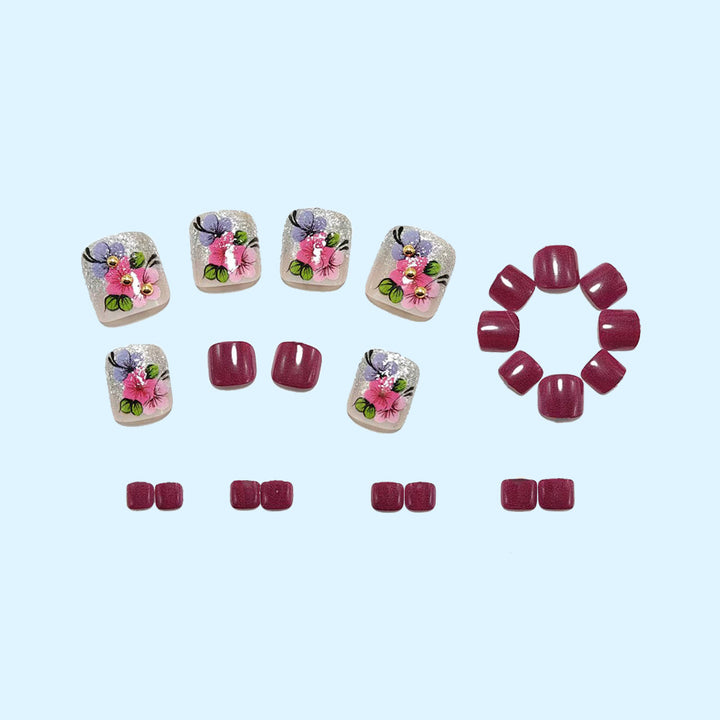 Kunstnägel mit floralen Motiven und Glitzer-Akzenten Karnz