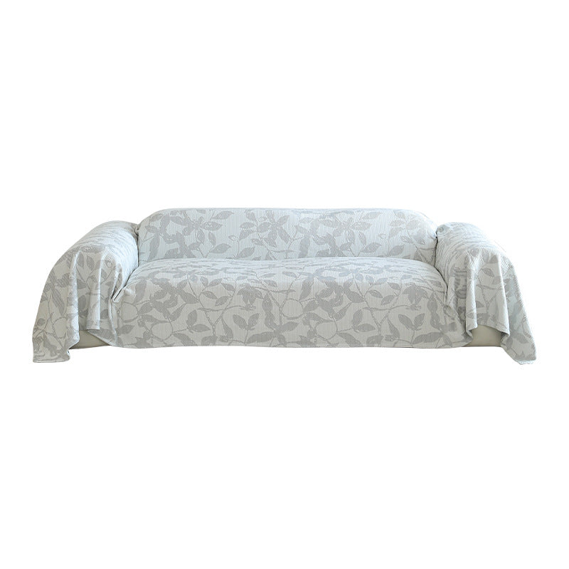 Elastischer Sofa‑Schonbezug mit floraler Reliefstruktur und universeller Passform