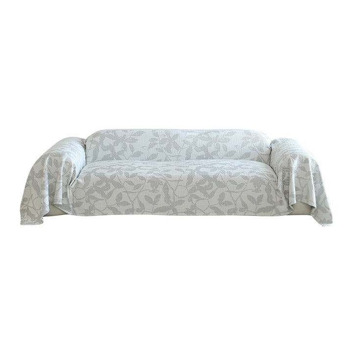 Elastischer Sofa‑Schonbezug mit floraler Reliefstruktur und universeller Passform