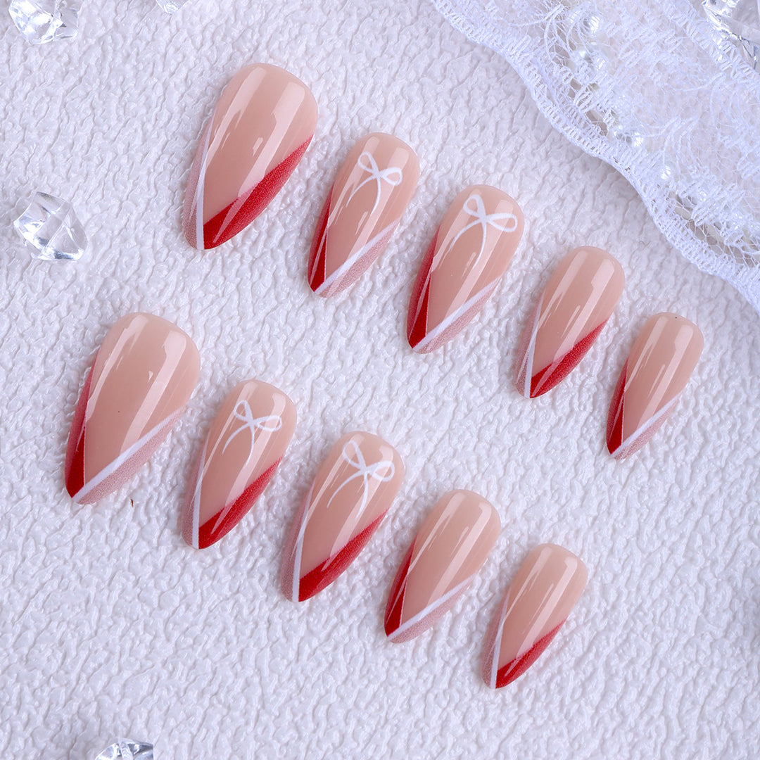 Kunstfingernägel Im Eleganten Stiletto-Design mit Schleifen-Akzenten Karnz