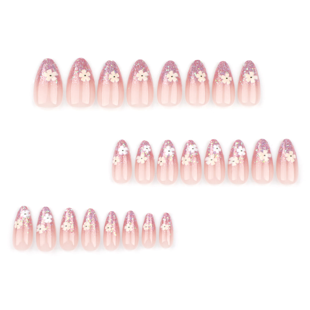 Glamouröse Nagelverlängerungen mit glitzerndem und floralem Design Karnz