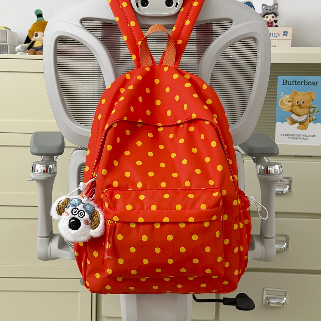 Verspielt gepunkteter Rucksack