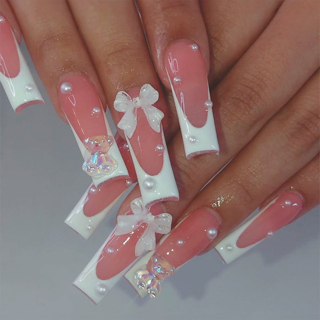 Kunstnagelset mit eleganten 3D-Schleifen und Glitzerakzenten Karnz