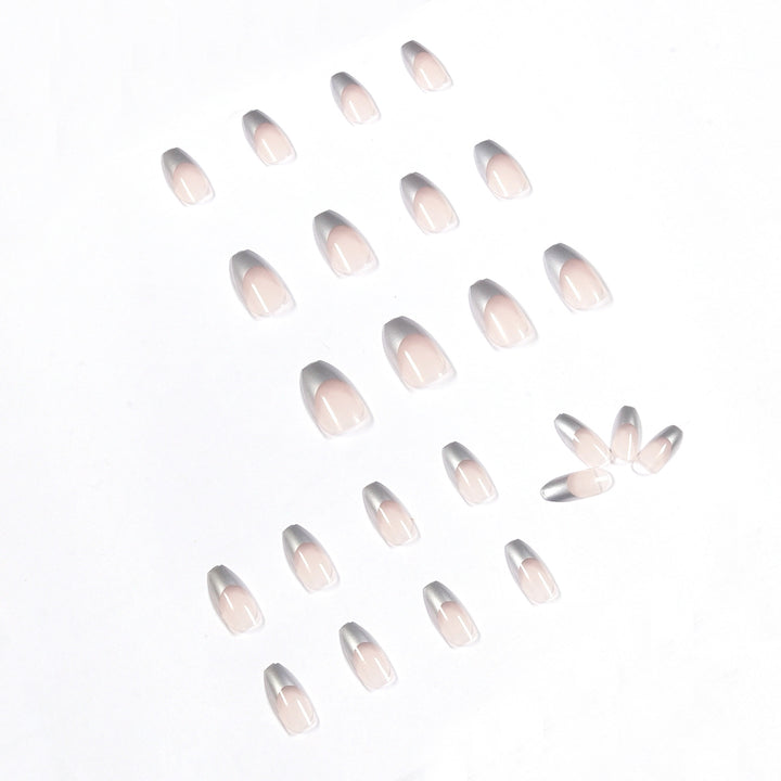Künstliche Stiletto-Nägel mit Glitzerakzenten und elegantem French-Tip Karnz
