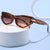 Damen trendige Cat-Eye-Sonnenbrille mit lackiertem Rahmen und akzentuierten Metall-Details Karnz