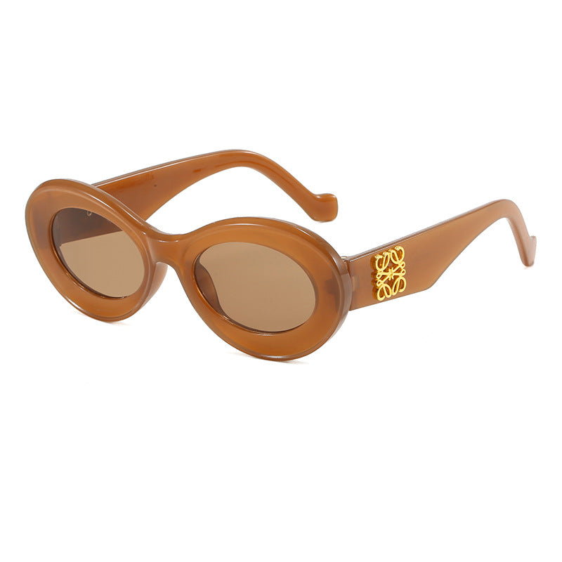 Damen modische Sonnenbrille mit ovalem Rahmen und goldenen Applikationen Karnz