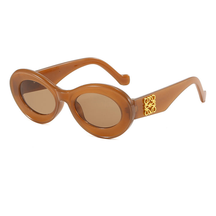 Damen modische Sonnenbrille mit ovalem Rahmen und goldenen Applikationen Karnz