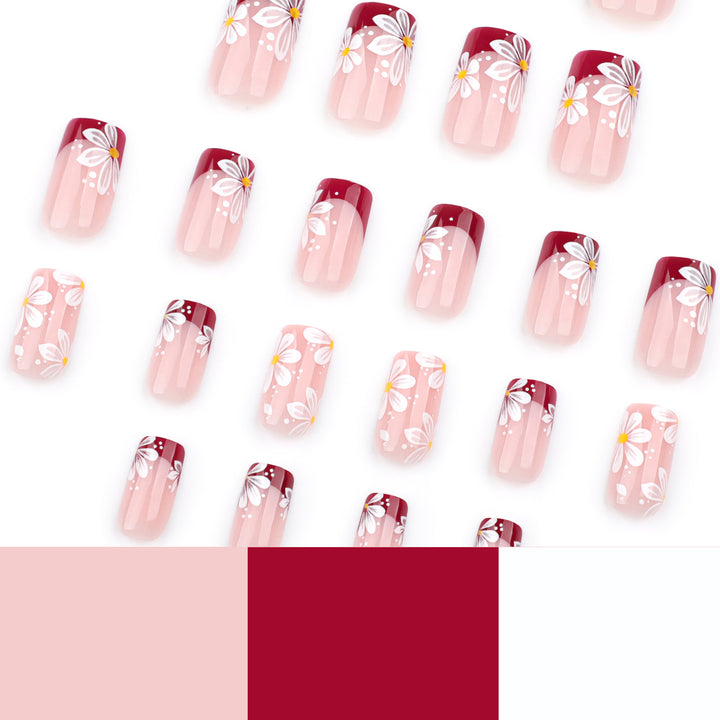 Kunstvolle Nagelverlängerungen mit Blumenmotiv Karnz