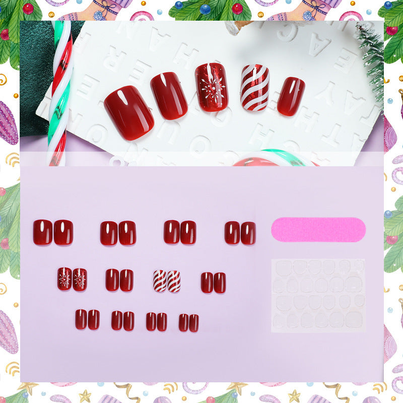 Kunstnagelset mit festlichen Designs und Glitzerakzenten Karnz