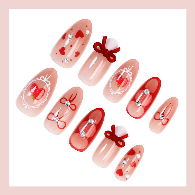 Kunstnagelset mit niedlichen Herz- und Schleifenmotiven Karnz