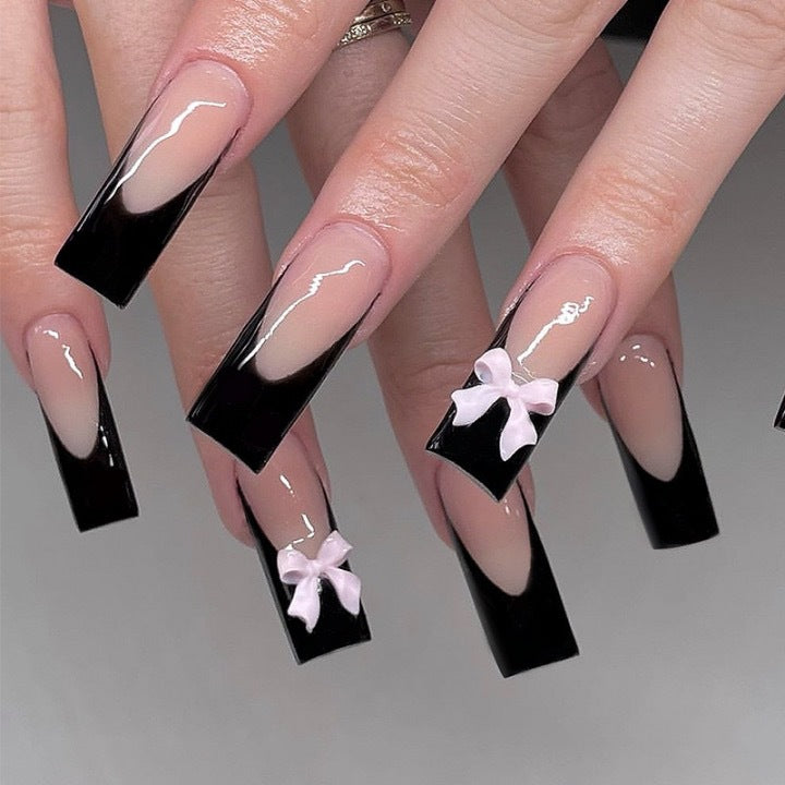 Kunstvolle Nagelverlängerungen mit Schleifen-Design Karnz