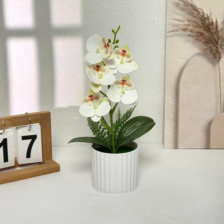 Faux Orchideen Arrangement für Innendekoration zuhause