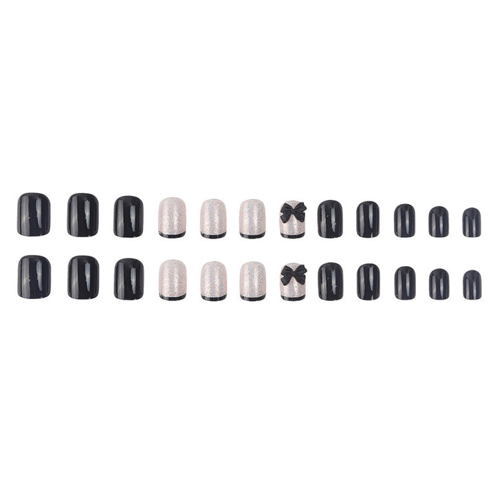 Elegante Stiletto Press-On Nail Set mit dekorativen Schleifenakzenten Karnz