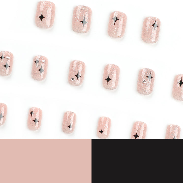 Kunstvolle Nagelverlängerungen mit Glitzer- und Sternenmuster Karnz