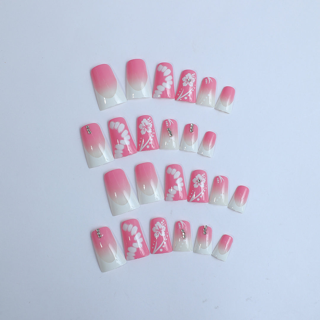Kunstnagelset mit eleganten Floral-Designs und Glitzerakzenten Karnz