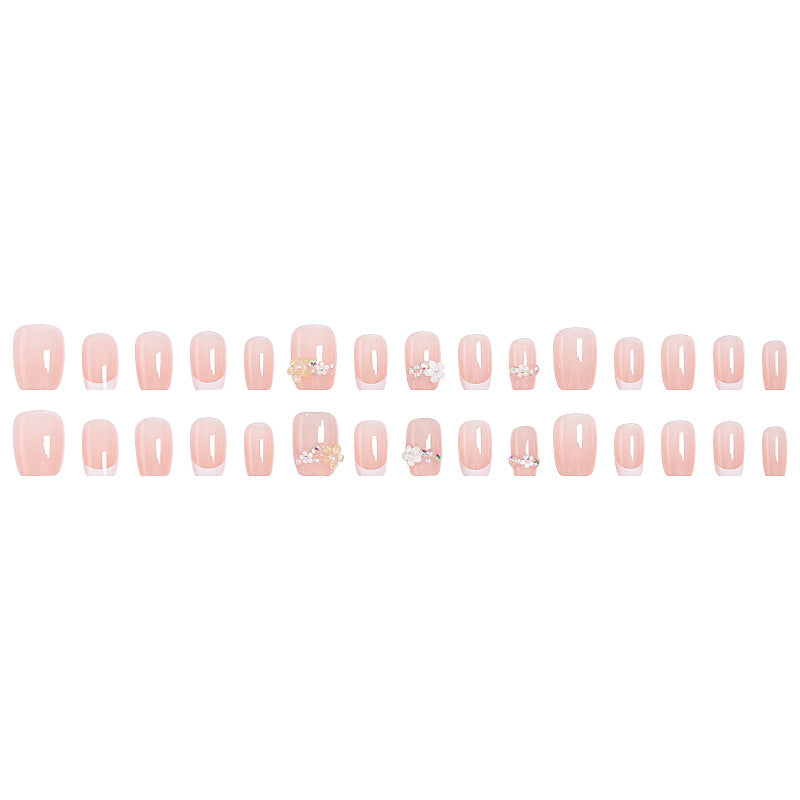 Kunstnagelset mit eleganten Blumenapplikationen und exquisite Glitzerverzierungen Karnz