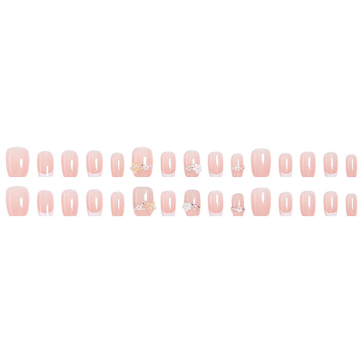 Kunstnagelset mit eleganten Blumenapplikationen und exquisite Glitzerverzierungen Karnz