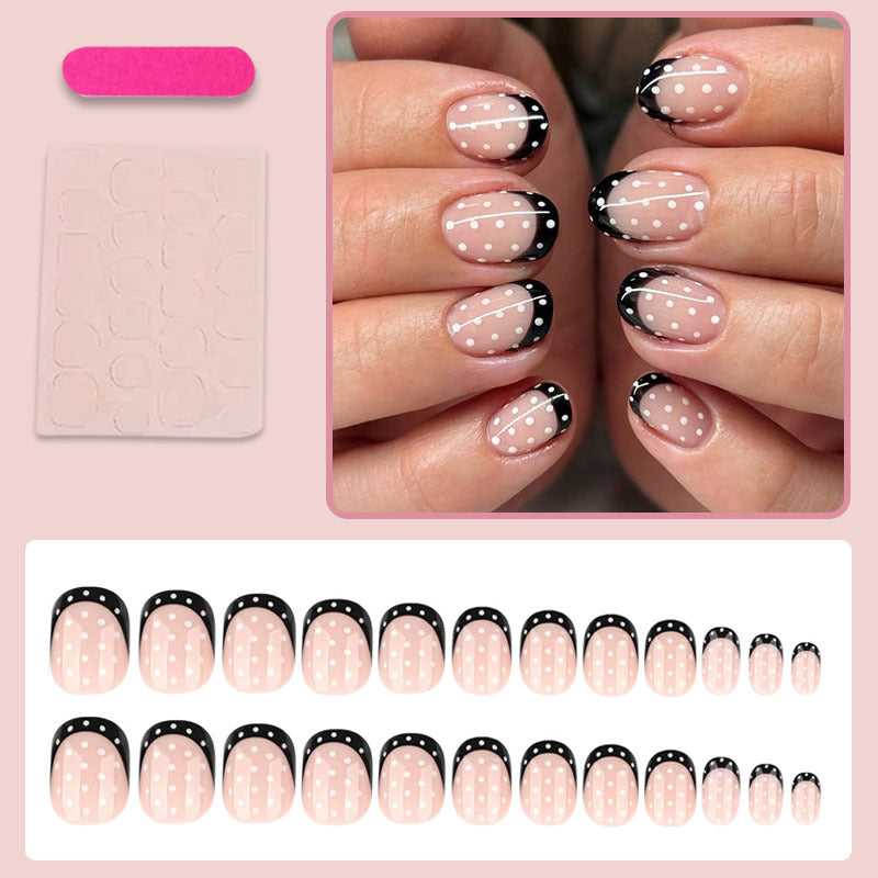 Kunstnagelset mit eleganten Punkten und stilvollem Schwarz Karnz