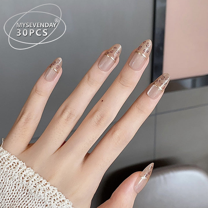 Elegantes Press-On-Nagelset mit goldenen Akzentspitzen Karnz