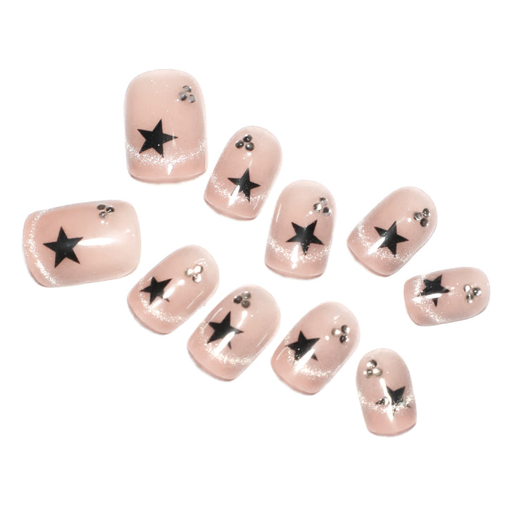 Kunstvolle Acryl-Nägel mit glamourösen Sternen-Motiven Karnz