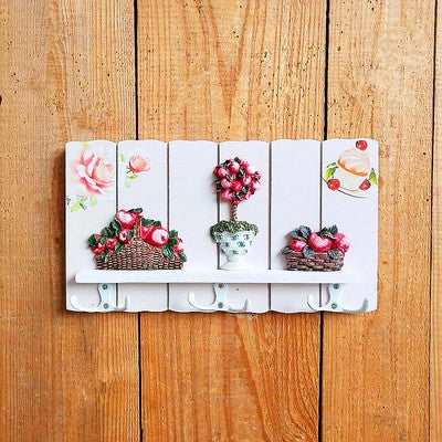 Dekorativer floral Wandhakenregal
