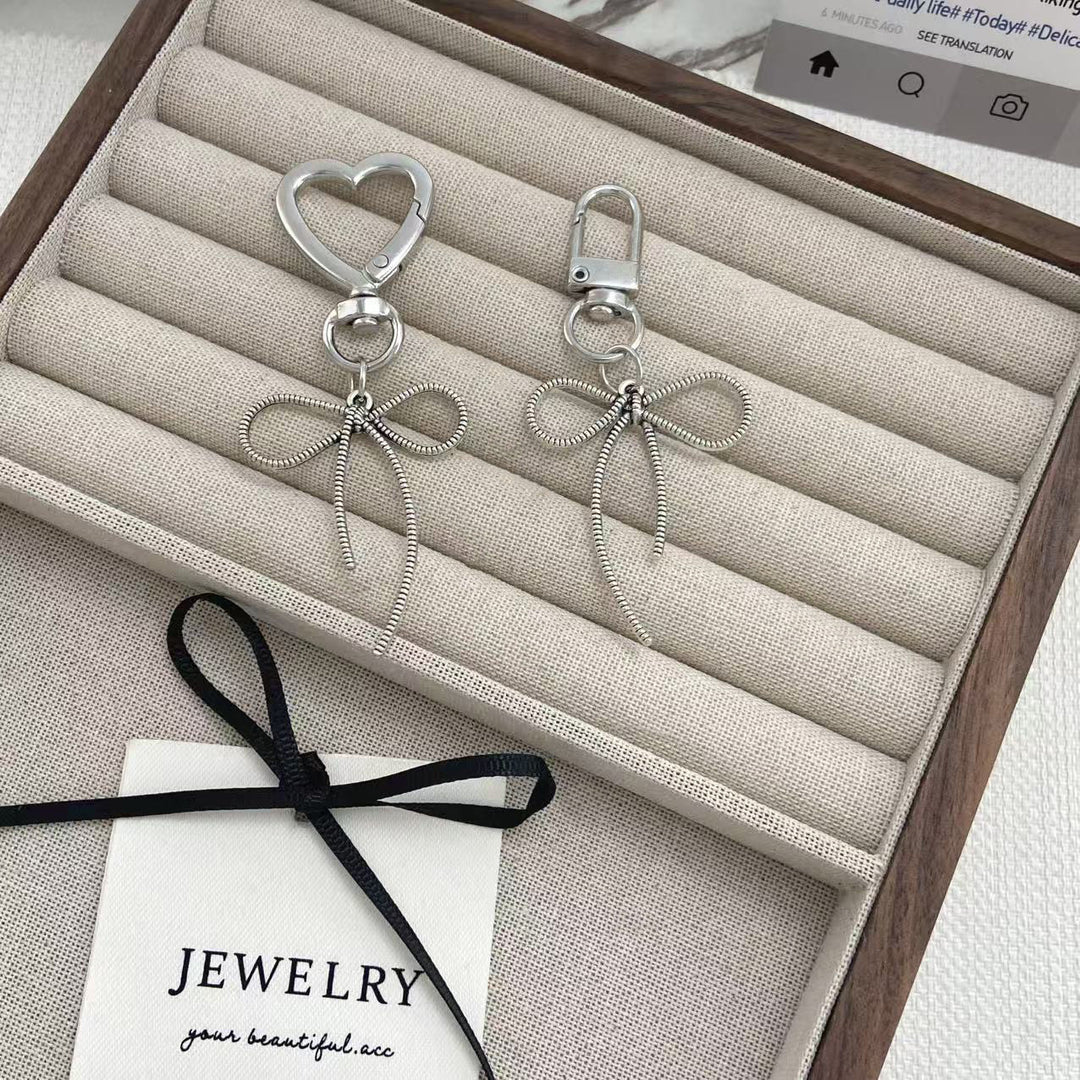 Elegante bogenförmige Schlüsselanhänger Karnz 1787102672