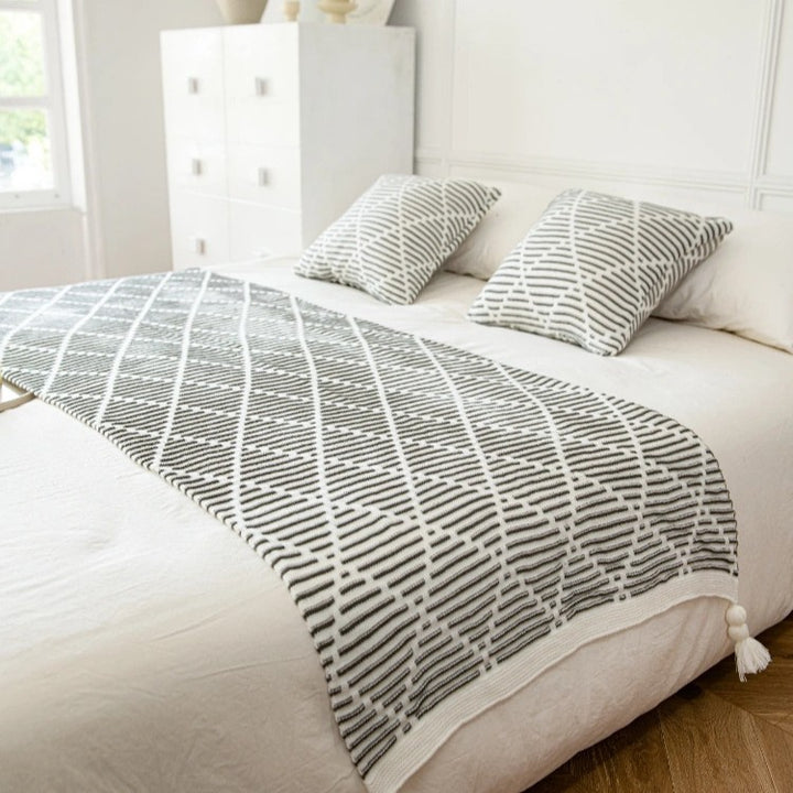 Dekorativer Strickwurfdecke