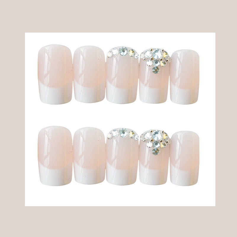 Elegante French Tip Press-On Nagelset mit Rhinstein-Akzenten