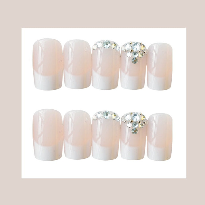 Elegante French Tip Press-On Nagelset mit Rhinstein-Akzenten