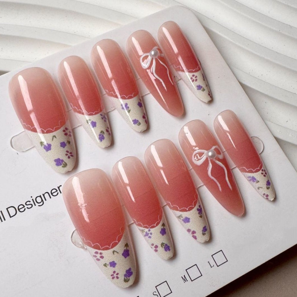 Elegantes Press-On-Nagelset mit Blumen- und Schleifendesign Karnz