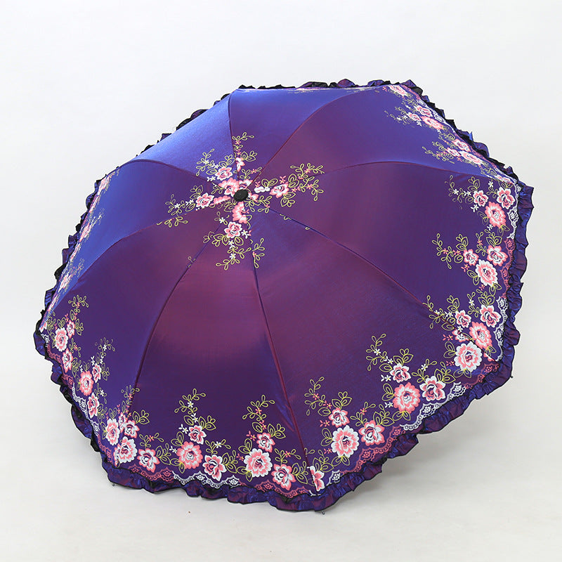 Damen Regenschirm mit fröhlichem Blumendruck und Wellenrand Karnz