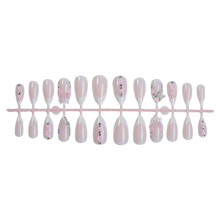 Kreatives Kunstnagelset mit verspielten Blüten- und Glitzerakzenten Karnz