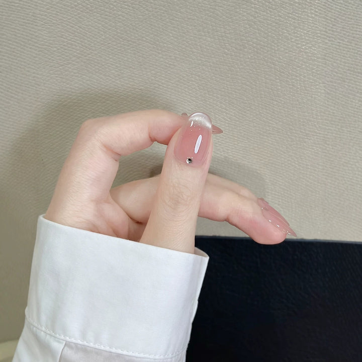 Elegante French Tip Press-On Nägel mit Kristallakzenten