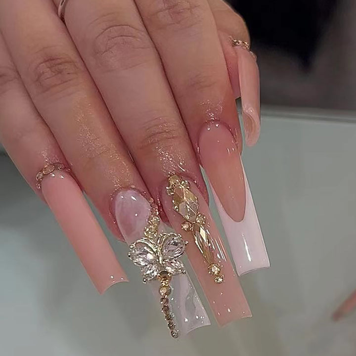 Elegante Lange Press-On Nagelset mit Dekorativen Edelsteinen und Blumenakzenten Karnz