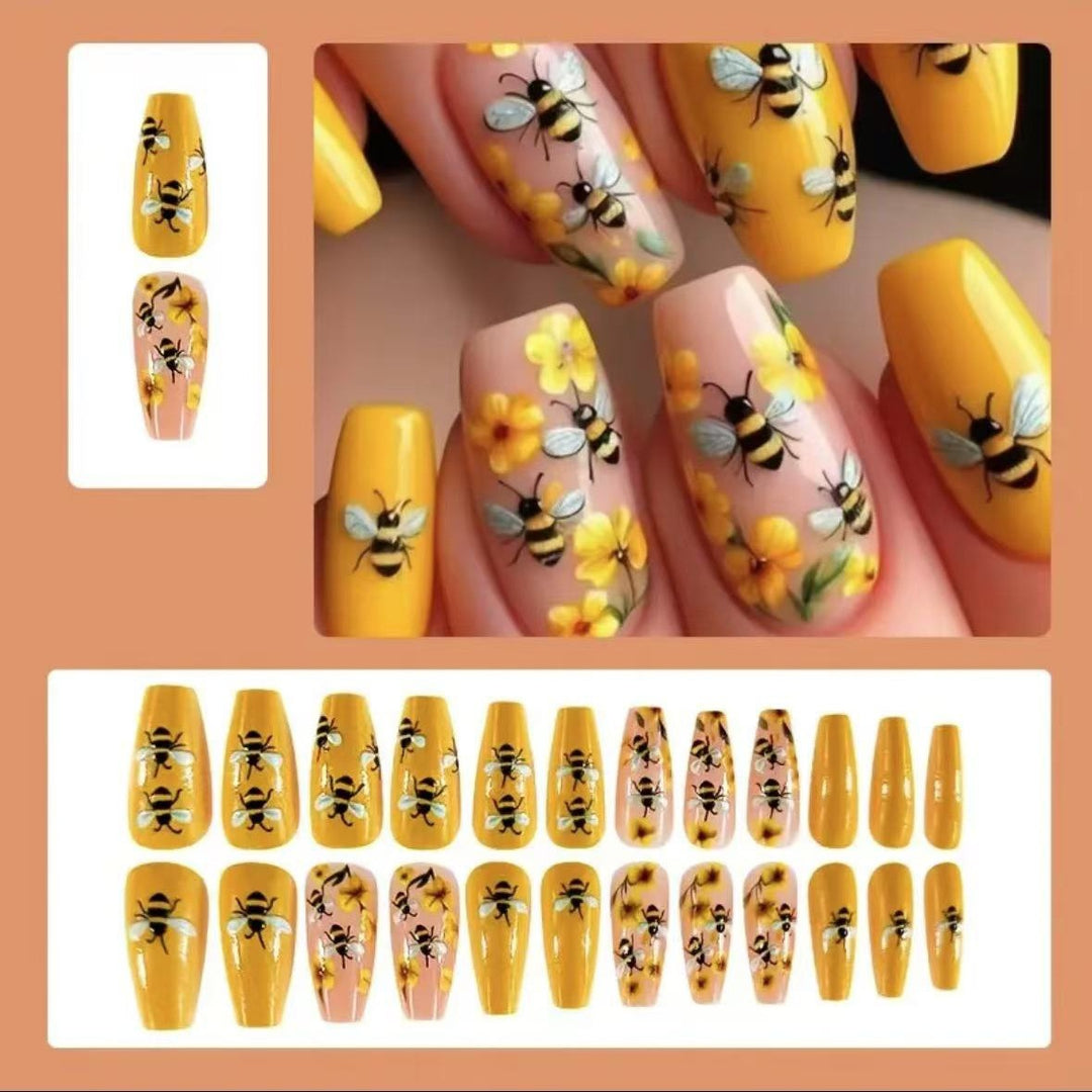 Kunstnagelset mit kreativen Bienen- und Blumendesigns Karnz