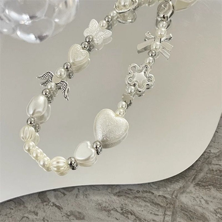 Herz und Schmetterling Charm Perlenarmband Karnz