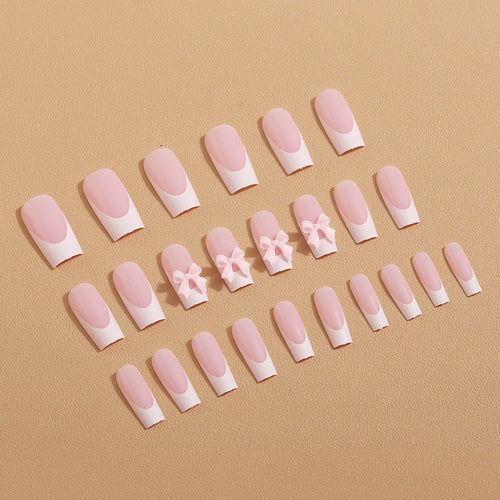 Kunstnagelset mit filigranen Schleifenverzierungen Karnz
