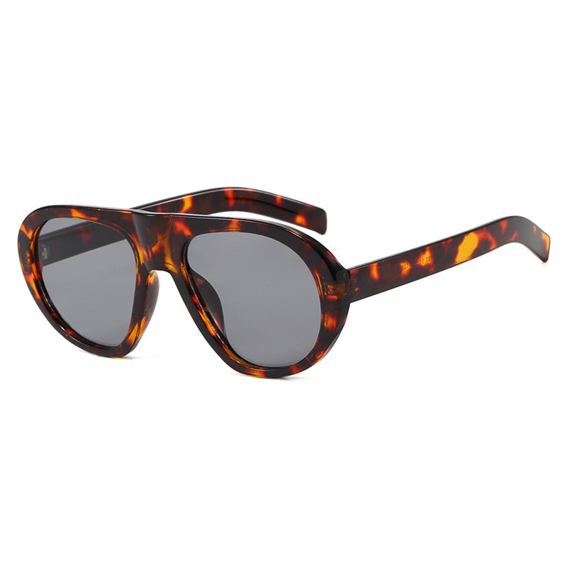 Damen auffällige Sonnenbrille mit futuristischem Rahmen und robustem Design Karnz