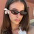 Damen ovalförmige Sonnenbrille mit transparentem Rahmen und UV-Schutz Karnz