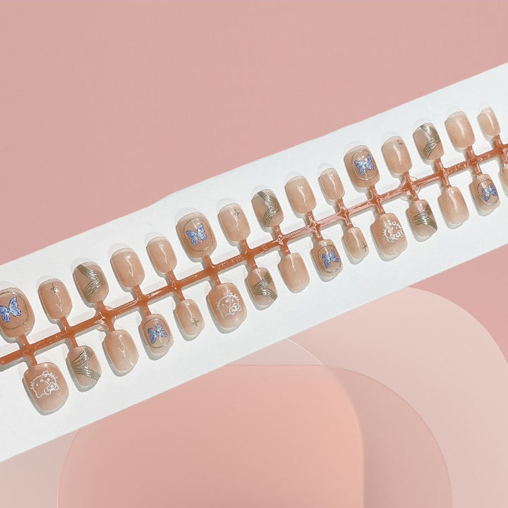 Künstlerisches Press-On-Nagelset mit Schmetterlings- und Metallic-Design Karnz