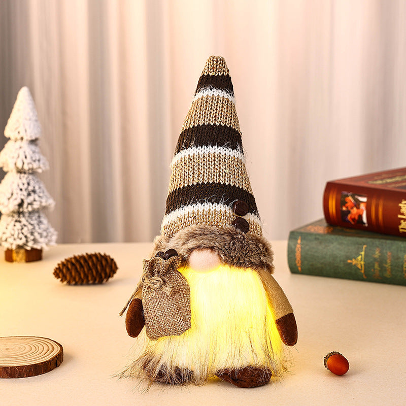 Dekorativer Weihnachtsgnom mit Geschenkpäckchen Karnz
