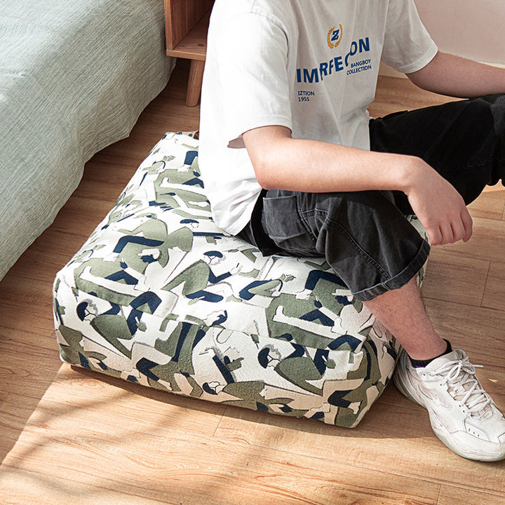 Sitzpouf aus gewebtem Baumwollmix mit gestepptem Diamant-Relief Karnz
